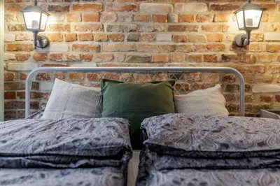 Łóżko lub łóżka w pokoju w obiekcie Weronika's Urban Hideaway