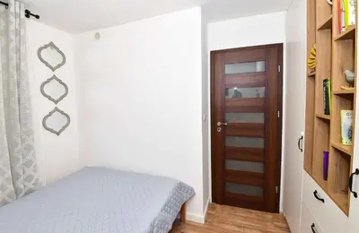 Łóżko lub łóżka w pokoju w obiekcie Klimat w Sercu Starówki