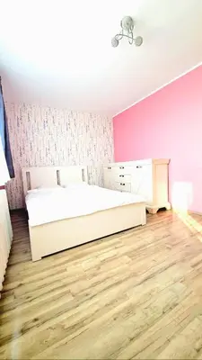 Łóżko lub łóżka w pokoju w obiekcie Mieszkaj po Królewsku