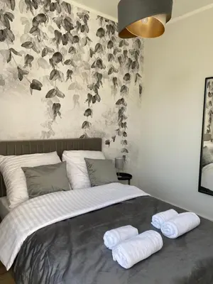 Łóżko lub łóżka w pokoju w obiekcie Apartament Kościuszki