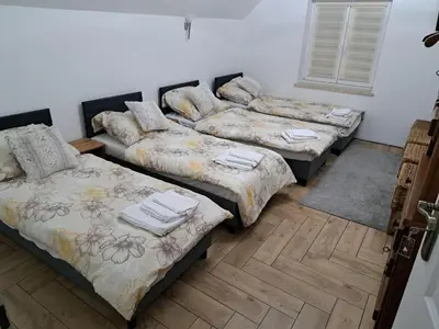 Łóżko lub łóżka w pokoju w obiekcie Pensjonat u cioci Reni