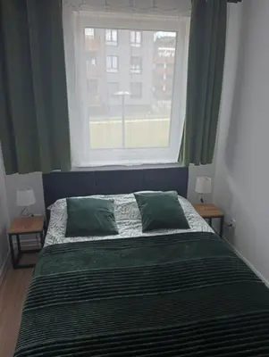 Łóżko lub łóżka w pokoju w obiekcie Apartament Diament 2 - Jezioro Nyskie