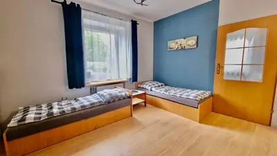 Łóżko lub łóżka w pokoju w obiekcie Tanie Noclegi Puszkina 1