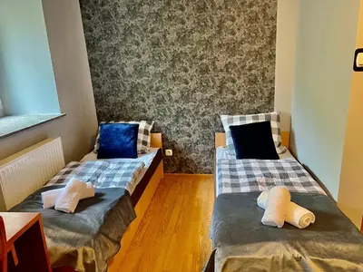 Łóżko lub łóżka w pokoju w obiekcie Tanie Noclegi Puszkina 2