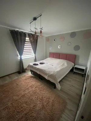 Łóżko lub łóżka w pokoju w obiekcie APARTAMENTY CIUKAJ