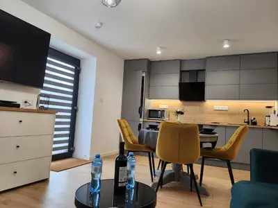 Telewizja i/lub zestaw kina domowego w obiekcie Apartament Forest