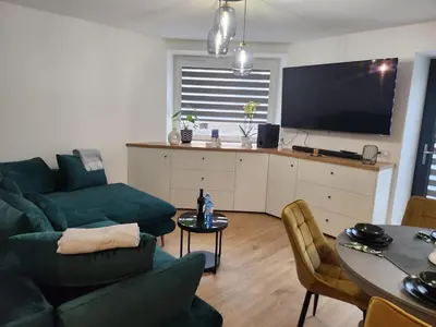 Telewizja i/lub zestaw kina domowego w obiekcie Apartament Forest
