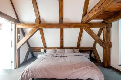 Łóżko lub łóżka w pokoju w obiekcie Roof Apartment