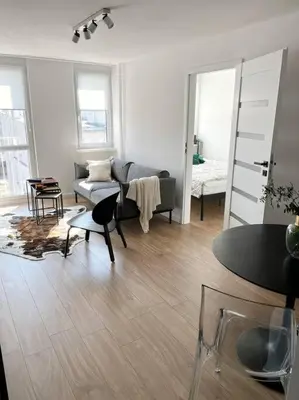 Łóżko lub łóżka w pokoju w obiekcie Komfort w Centrum Wrocławia