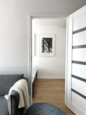 Łóżko lub łóżka w pokoju w obiekcie Komfort w Centrum Wrocławia