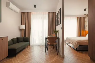 Łóżko lub łóżka w pokoju w obiekcie Studio Verde Legnicka Residence