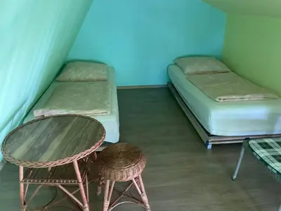 Łóżko lub łóżka w pokoju w obiekcie Jezioranka