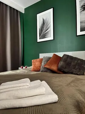 Łóżko lub łóżka w pokoju w obiekcie Apartament Zielone Podwale