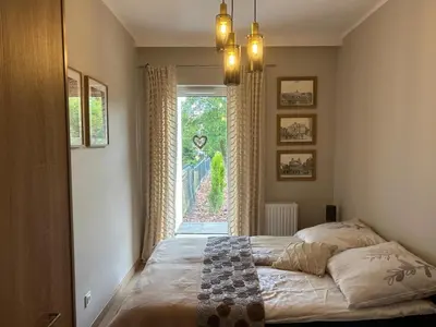 Łóżko lub łóżka w pokoju w obiekcie Apartament Słoneczna polana