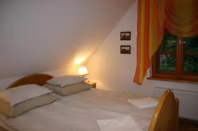 Łóżko lub łóżka w pokoju w obiekcie Apartament Pod Bukiem