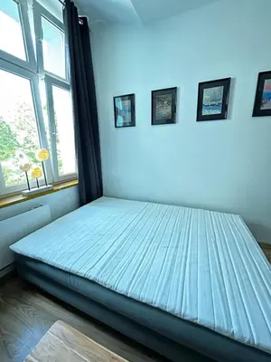 Łóżko lub łóżka w pokoju w obiekcie Apartament przy Rynku Świętego Antoniego