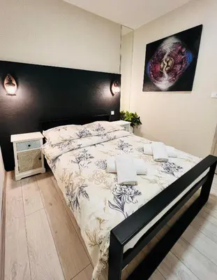 Łóżko lub łóżka w pokoju w obiekcie Apartament Na Starówce