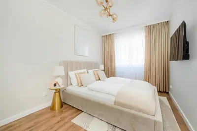 Łóżko lub łóżka w pokoju w obiekcie Piękny Apartament Wichrowa - 2 Sypialnie FREE GARAGE Wrocław by Noclegi Renters