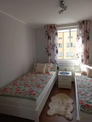 Łóżko lub łóżka w pokoju w obiekcie Apartament blisko Rynku