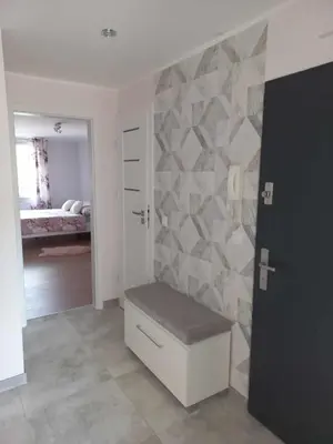 Łóżko lub łóżka w pokoju w obiekcie Apartament blisko Rynku