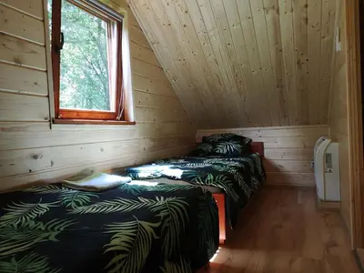 Łóżko lub łóżka w pokoju w obiekcie Janowickie Zacisze