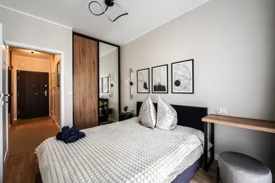 Łóżko lub łóżka w pokoju w obiekcie river point Mieszczańska 24 m50