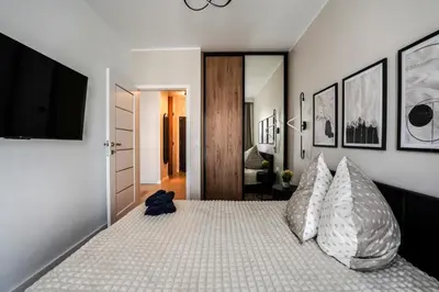 Łóżko lub łóżka w pokoju w obiekcie river point Mieszczańska 24 m50