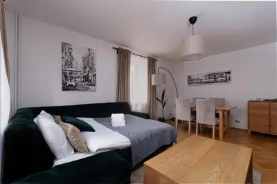 Łóżko lub łóżka w pokoju w obiekcie Park Szczytnicki 2-Bedroom Apartment by BookingHost