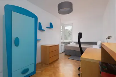 Łóżko lub łóżka w pokoju w obiekcie Park Szczytnicki 2-Bedroom Apartment by BookingHost