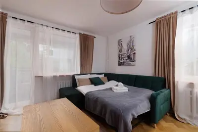 Łóżko lub łóżka w pokoju w obiekcie Park Szczytnicki 2-Bedroom Apartment by BookingHost