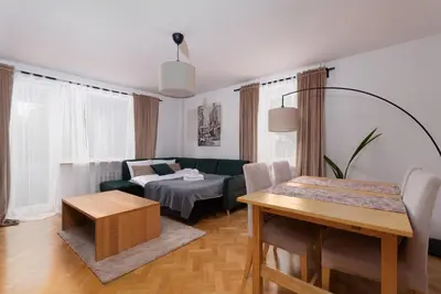 Łóżko lub łóżka w pokoju w obiekcie Park Szczytnicki 2-Bedroom Apartment by BookingHost