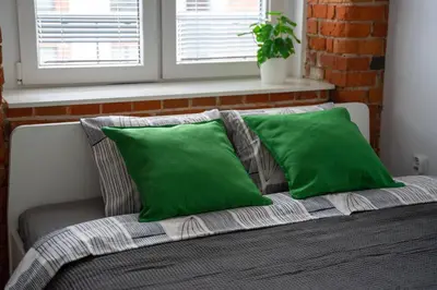 Łóżko lub łóżka w pokoju w obiekcie Apartament z antresolą Nowa Papiernia