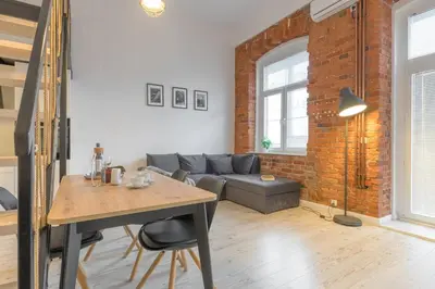 Część wypoczynkowa w obiekcie Apartament z antresolą Nowa Papiernia