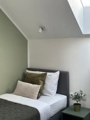 Łóżko lub łóżka w pokoju w obiekcie Moment