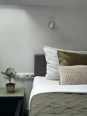 Łóżko lub łóżka w pokoju w obiekcie Moment