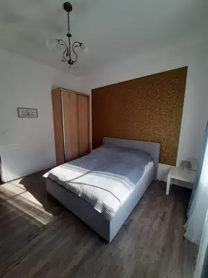 Łóżko lub łóżka w pokoju w obiekcie Apartament GALERIA