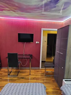 Telewizja i/lub zestaw kina domowego w obiekcie Wrocław Tanie Noclegi
