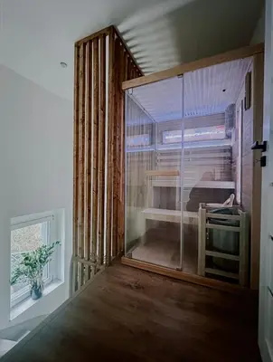 Łóżko lub łóżka w pokoju w obiekcie SowaSMART Apartament z sauną