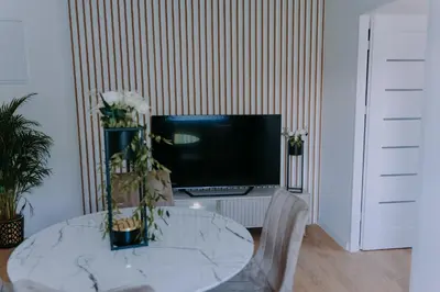 Telewizja i/lub zestaw kina domowego w obiekcie SowaSMART Apartament z sauną