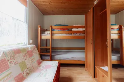 Łóżko lub łóżka w pokoju w obiekcie Domki letniskowe OWRAC
