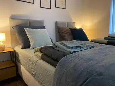 Łóżko lub łóżka w pokoju w obiekcie Apartament pod Sejdakiem