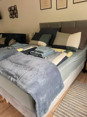 Łóżko lub łóżka w pokoju w obiekcie Apartament pod Sejdakiem