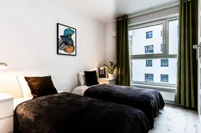 Łóżko lub łóżka w pokoju w obiekcie Pure Rental Premium Apartments - Free Parking & AC