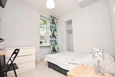 Łóżko lub łóżka w pokoju w obiekcie ApartHostel 