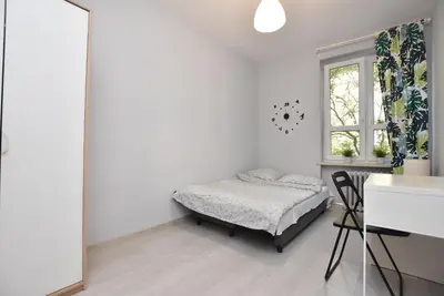Łóżko lub łóżka w pokoju w obiekcie ApartHostel 