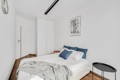 Łóżko lub łóżka w pokoju w obiekcie Prime Time Apartament - 24h check -in - Parking w cenie