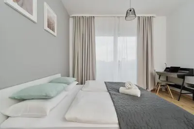 Łóżko lub łóżka w pokoju w obiekcie Modern Studio Słonimskiego with Balcony by Noclegi Renters