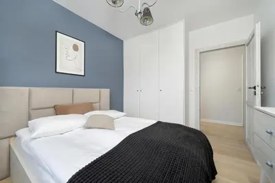 Łóżko lub łóżka w pokoju w obiekcie Wyjątkowy Apartament z Parkingiem dla 6 osób by Noclegi Renters