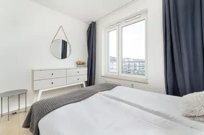 Łóżko lub łóżka w pokoju w obiekcie Wyjątkowy Apartament z Parkingiem dla 6 osób by Noclegi Renters