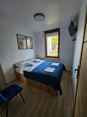 Łóżko lub łóżka w pokoju w obiekcie Apartament Radiostacja III z ogródkiem, parking free